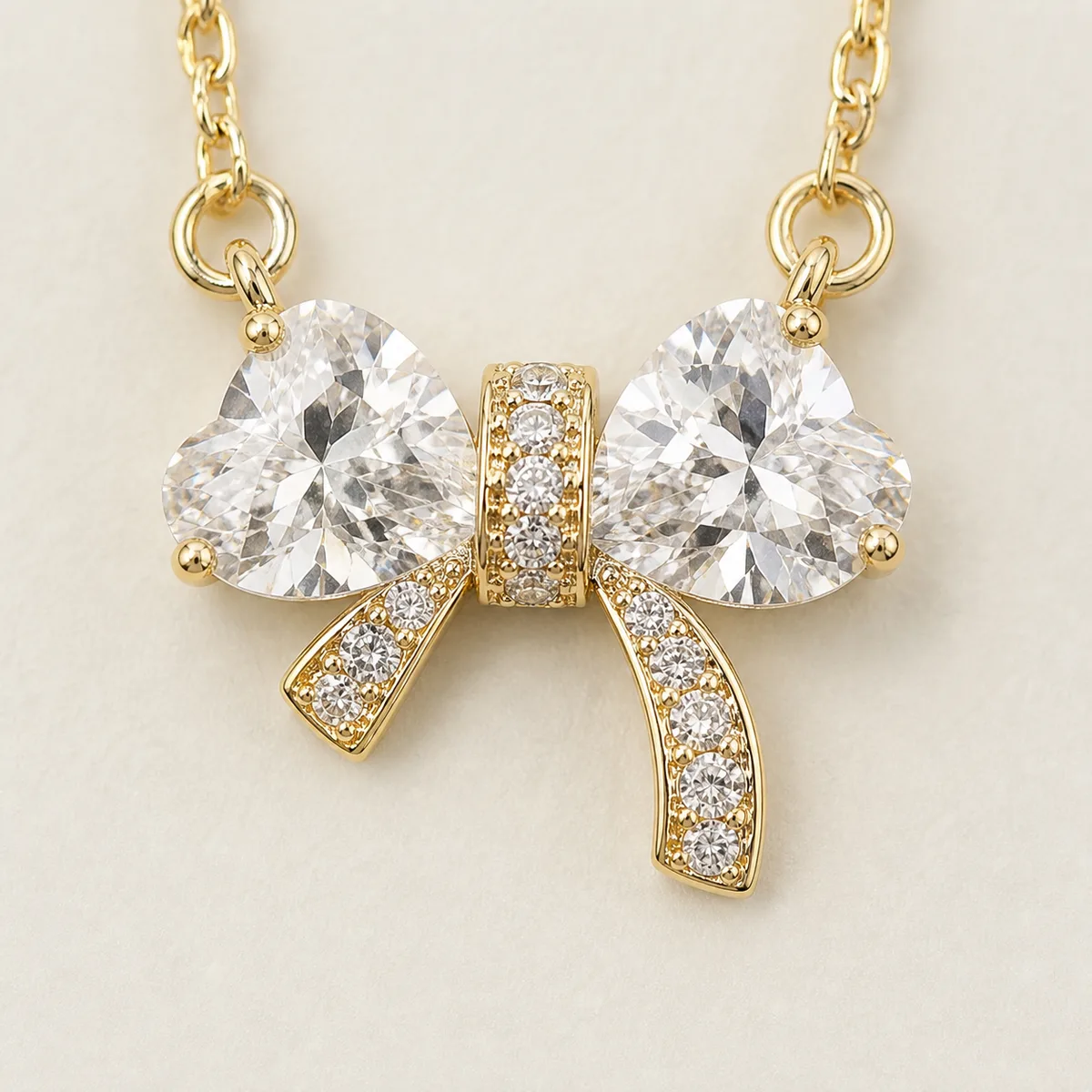 Gold Clear Crystal Bow Necklace — view 3