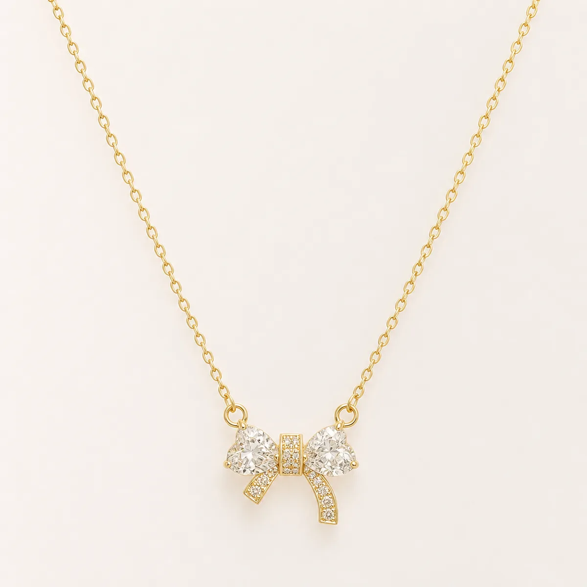 Gold Clear Crystal Bow Necklace — view 1