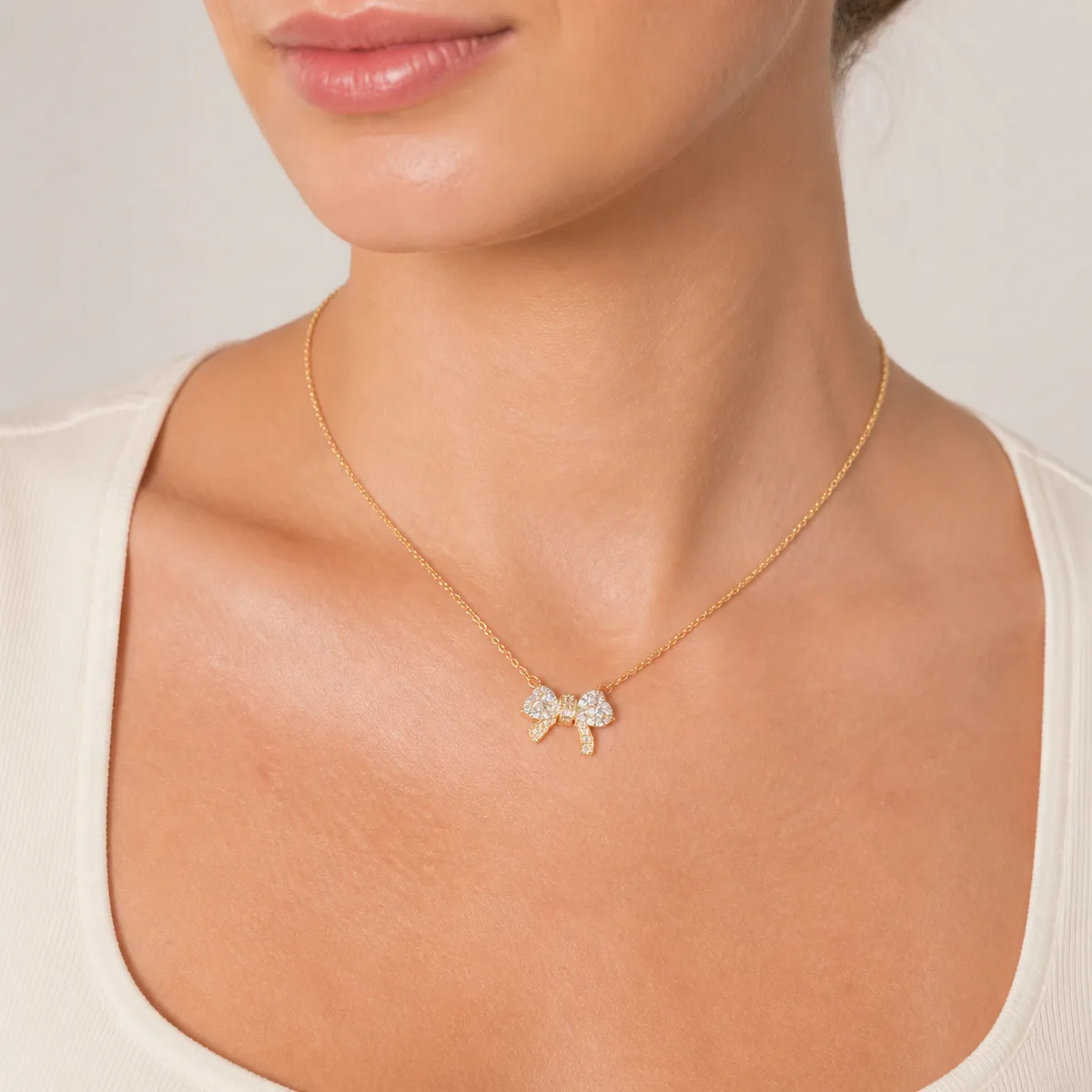 Gold Clear Crystal Bow Necklace — view 4