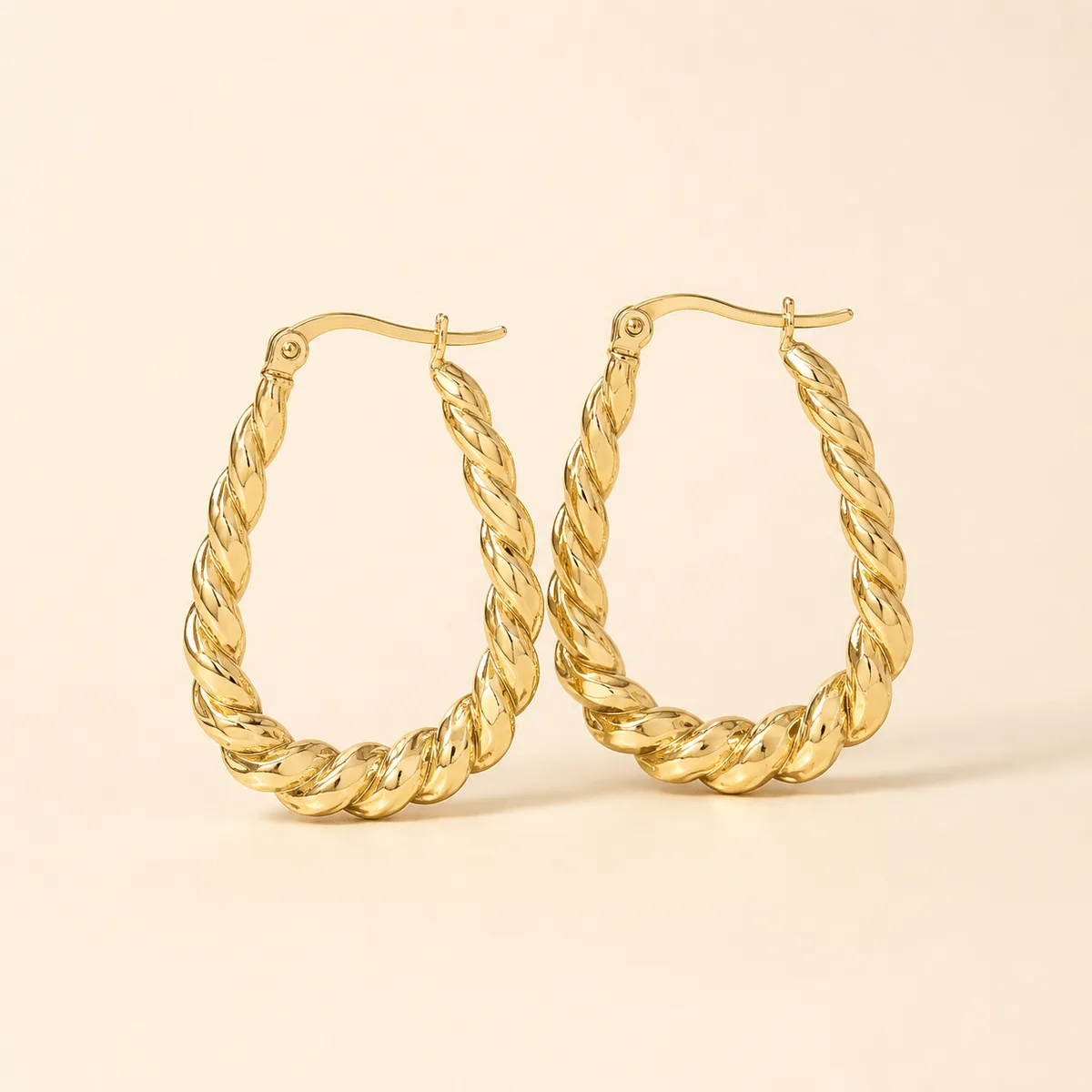 Gold Twisted Rope Teardrop Hoop Earrings — view 1